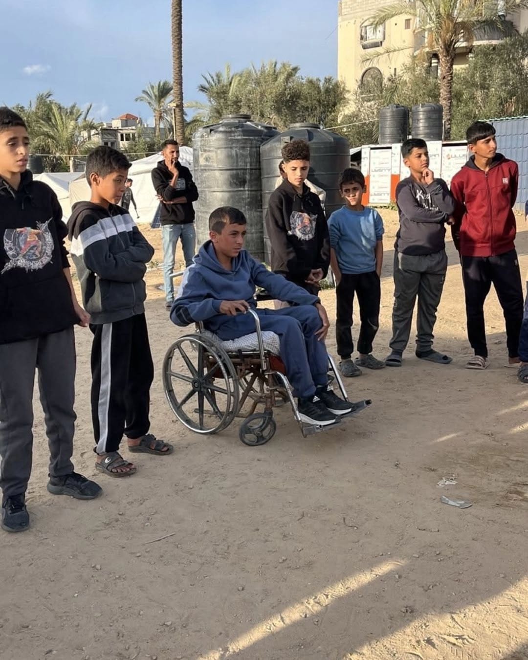 “Activit team interacting with and supporting individuals with disabilities during a community program in Gaza”