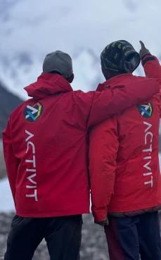 Activit athlete posing in snow during winter sports setting